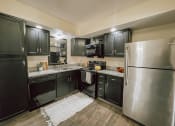 Thumbnail 1 of 18 - Fully equipped kitchen with espresso cabinets and stainless steel appliances