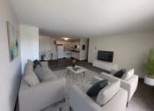 Thumbnail 2 of 16 - a living room with couches and a coffee table