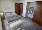 Thumbnail 8 of 16 - a bedroom with a bed and a closet