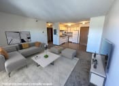 Thumbnail 1 of 16 - a view of the living room and kitchen from the balcony