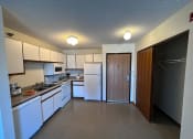 Thumbnail 5 of 16 - a kitchen with white appliances and white cabinets
