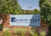 Thumbnail 16 of 16 - a sign at the entrance of pointe west apartments
