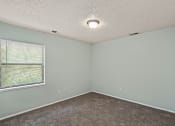 Thumbnail 6 of 27 - bedroom with a large window