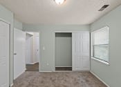 Thumbnail 4 of 27 - bedroom with a closet and a window