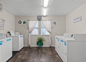 Thumbnail 13 of 27 - a laundry room with washes and dryers