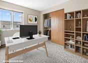 Thumbnail 5 of 11 - A modern home office with a desk, chair, and bookshelf.
