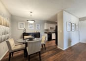 Thumbnail 1 of 29 - a dining room and kitchen with a table and chairs