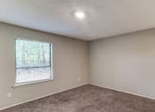 Thumbnail 15 of 29 - spacious bedroom with window at Quail Hollow apartment