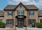 Thumbnail 31 of 35 - A stone building with a black awning that says Reserve.