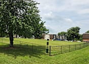 Thumbnail 21 of 26 - Dog park at River Chase Apartments in Florissant, MO