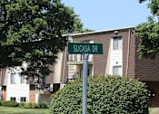 Thumbnail 26 of 26 - a street sign in front of a building
