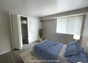 Thumbnail 10 of 22 - a bedroom with a bed and a closet