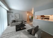 Thumbnail 7 of 22 - a living room with a couch and a table