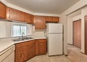 Thumbnail 7 of 35 - kitchen with wood style cabinets and double sink