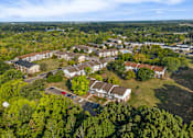 Thumbnail 31 of 31 - A bird's eye view of a residential area with houses and trees.