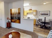 Thumbnail 1 of 35 - A living room with a painting of trees on the wall.