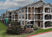 Thumbnail 34 of 35 - A large apartment complex with a sign that says Residence.