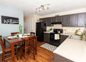 Thumbnail 1 of 32 - Kitchen and Dining Area