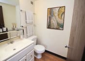Thumbnail 11 of 22 - a bathroom with a sink toilet and mirror