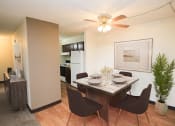 Thumbnail 5 of 22 - a dining and kitchen area with a table