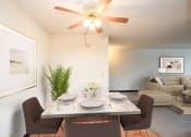 Thumbnail 3 of 22 - a dining room with a table and chairs and a ceiling fan