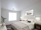 Thumbnail 5 of 33 - A bedroom with a large bed and a painting above it.
