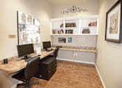 Thumbnail 13 of 33 - a home office with two computer desks and two chairs