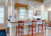 Thumbnail 11 of 33 - a clubhouse kitchen with a bar