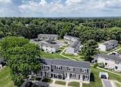 Thumbnail 35 of 39 - A bird's eye view of a residential area with houses and trees.