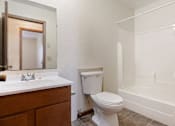 Thumbnail 13 of 22 - a bathroom with a toilet and a sink
