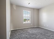 Thumbnail 12 of 22 - bedroom with a window and carpet