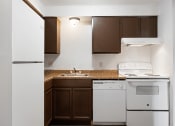 Thumbnail 1 of 25 - a kitchen with white appliances and a counter top