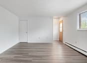 Thumbnail 2 of 25 - apartment living room with white walls and wood style floors