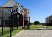 Thumbnail 24 of 30 - a basketball hoop in front of River Ranch Apartments