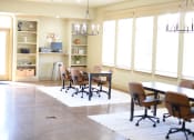 Thumbnail 17 of 30 - business center area with a table and chairs