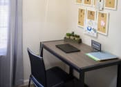 Thumbnail 18 of 30 - a desk with a laptop and a chair in a room