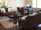 Thumbnail 15 of 30 - a living room with couches chairs and a table