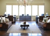 Thumbnail 13 of 30 - a living room with couches and a coffee table