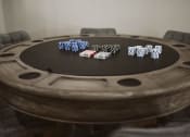 Thumbnail 12 of 30 - a poker table with chips and cards