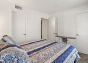 Thumbnail 9 of 23 - a bedroom with a bed and a closet