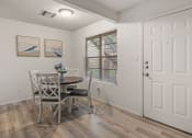Thumbnail 2 of 23 - a dining room with a table and chairs and a window