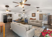 Thumbnail 13 of 23 - a living room and dining room with couches