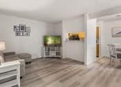 Thumbnail 3 of 23 - a living room with a couch and a tv