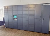 Thumbnail 13 of 30 - A row of tall, gray lockers are labeled Saddlecreek.