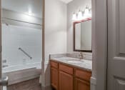 Thumbnail 3 of 22 - a bathroom with a bathtub and a sink