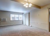 Thumbnail 2 of 22 - a bedroom with a large window and a chandelier