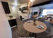 Thumbnail 1 of 20 - A modern kitchen with a dining table and chairs.