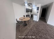 Thumbnail 2 of 20 - A photo of a living room with a dining table and chairs.