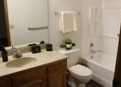 Thumbnail 21 of 35 - a bathroom with a toilet sink and bathtub
