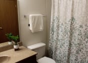Thumbnail 20 of 35 - a bathroom with a toilet sink and shower